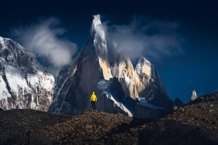 Jagged granite peaks overlooking a turquoise lake in Patagonia, Argentina